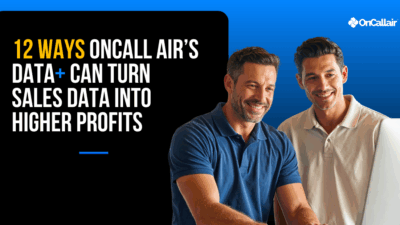 Two HVAC professionals reviewing a Data+ graph on a tablet, discussing sales insights and strategies to increase revenue and margins.